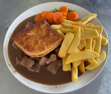 Steak pie chips and peas